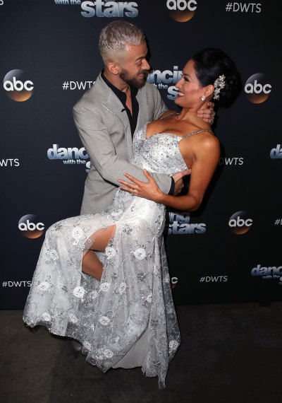 Nikki Bella and Artem Chigvintsev posing ahead of Dancing with the Stars Season 25