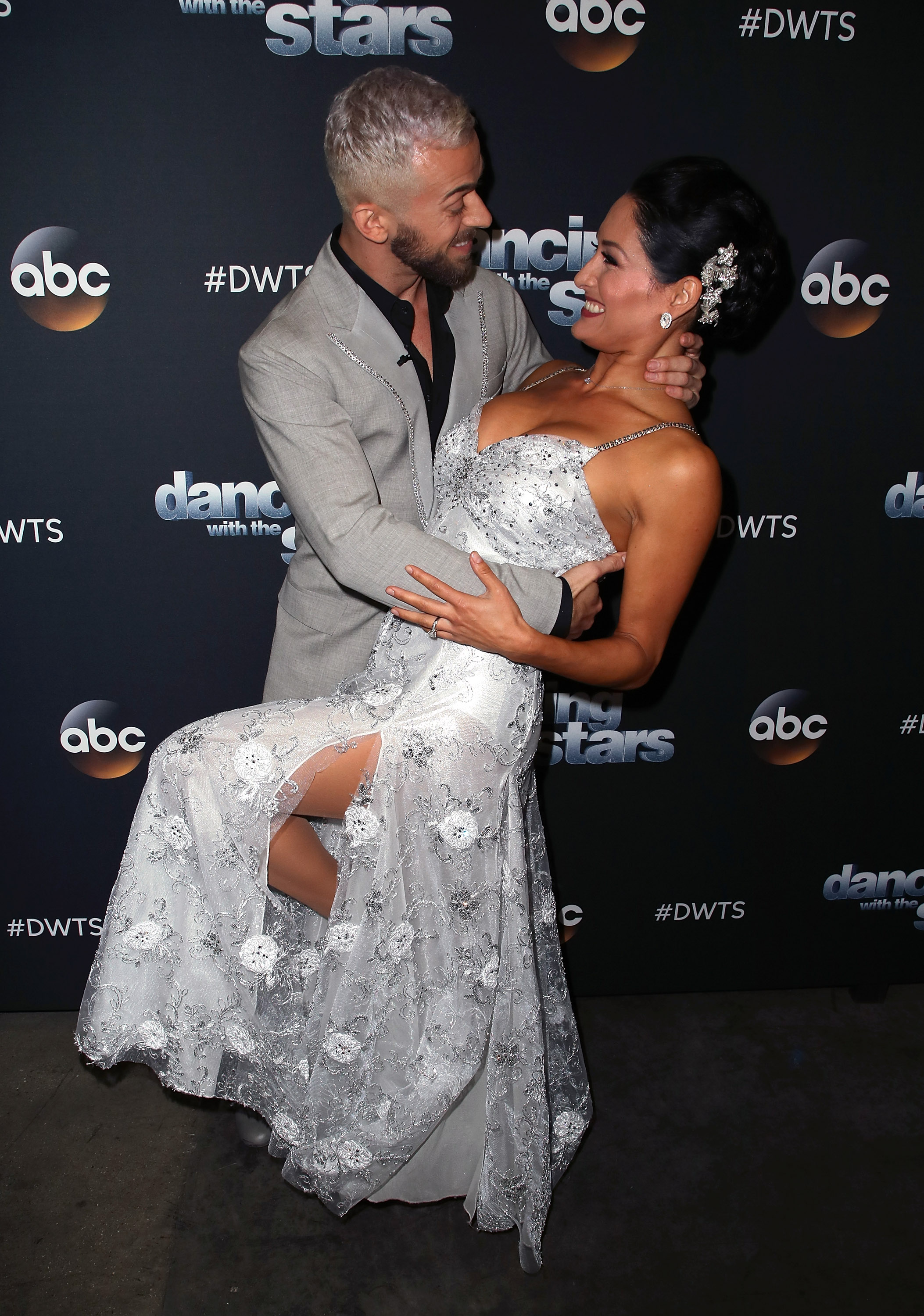 Nikki Bella and Artem Chigvintsev posing ahead of Dancing with the Stars Season 25