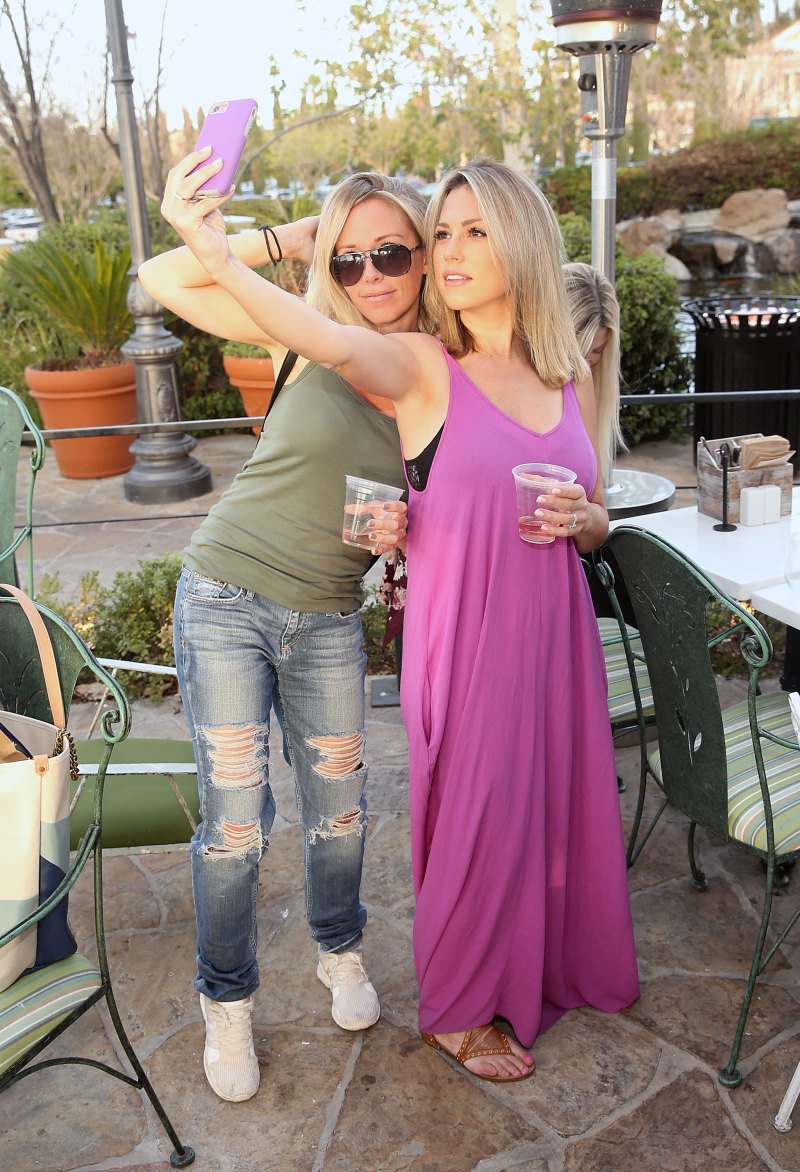 The Millennial Mamas' Mom's Night Out kendra wilkinson in green tank top and jeans takes selfie with friend in long pink dress