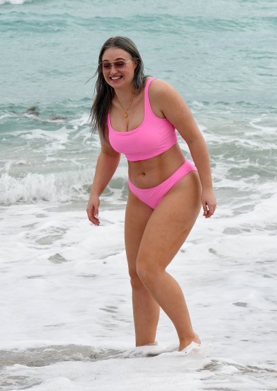 Iskra Lawrence in a pink bikini on the beach
