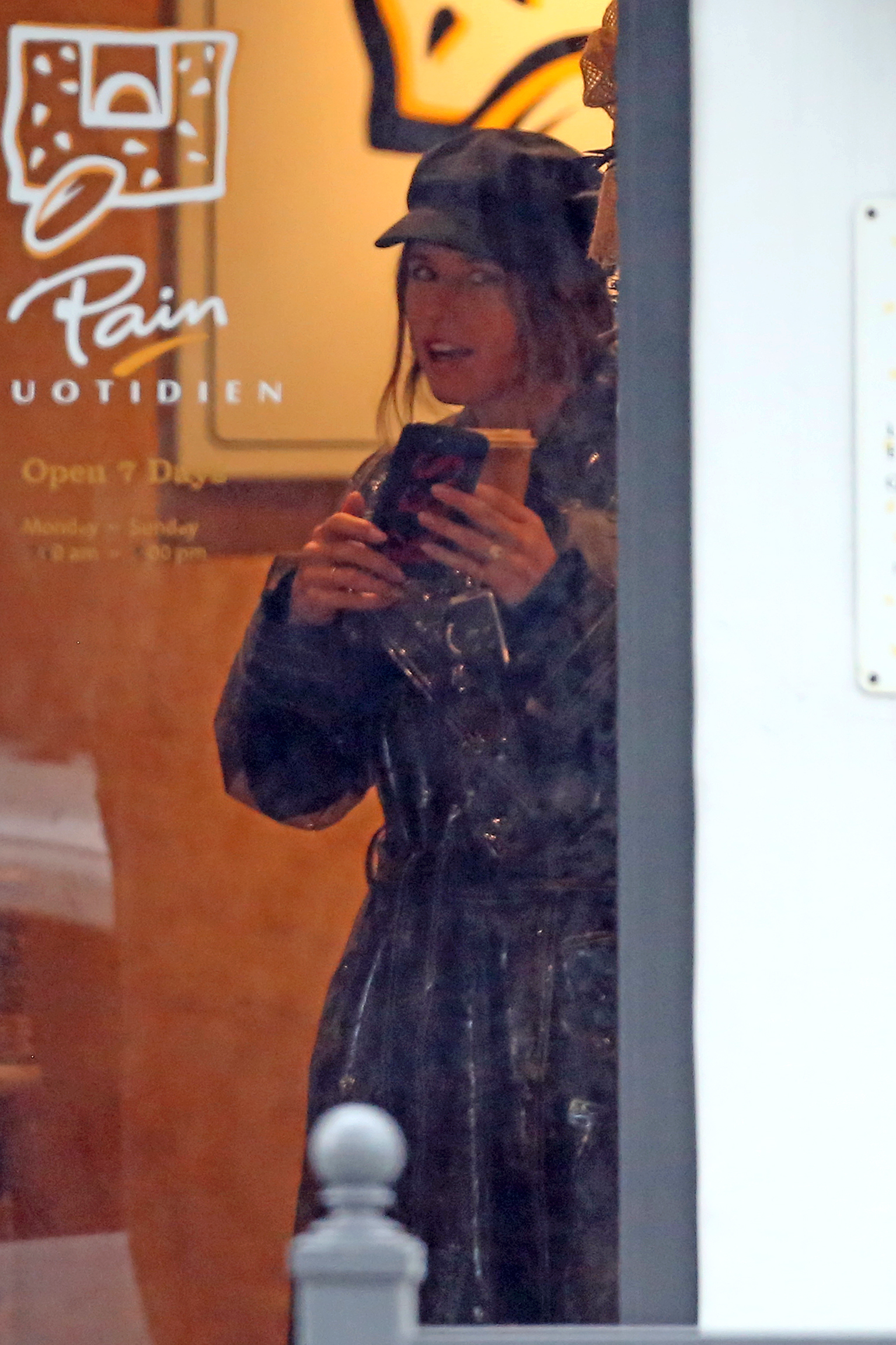 Katherine Schwarzenegger shows of her engagement ring while out to breakfast with sister Christina.