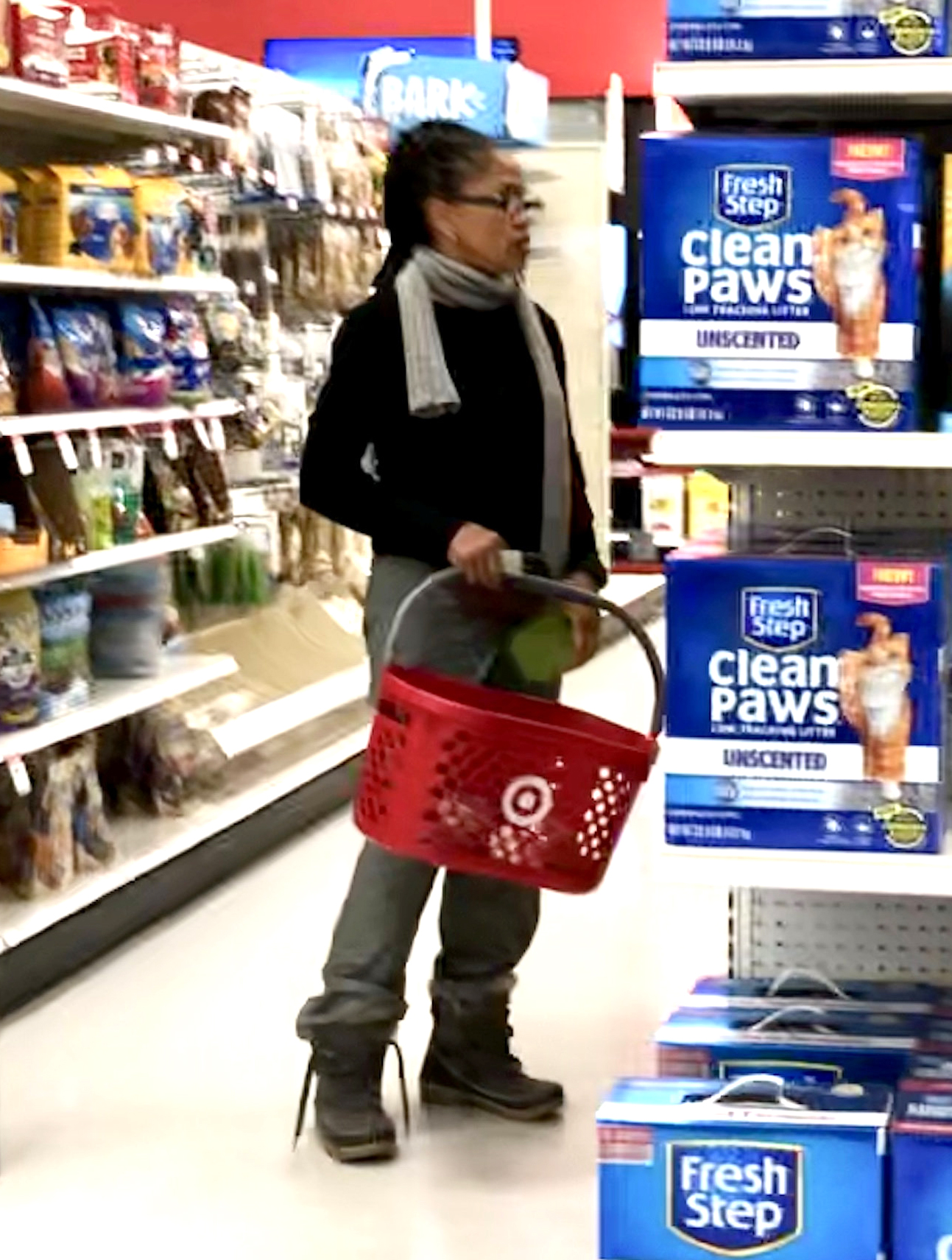 Meghan Markle's mom Doria Ragland shopping at target wearing jeans, a blue sweater, and white scarf