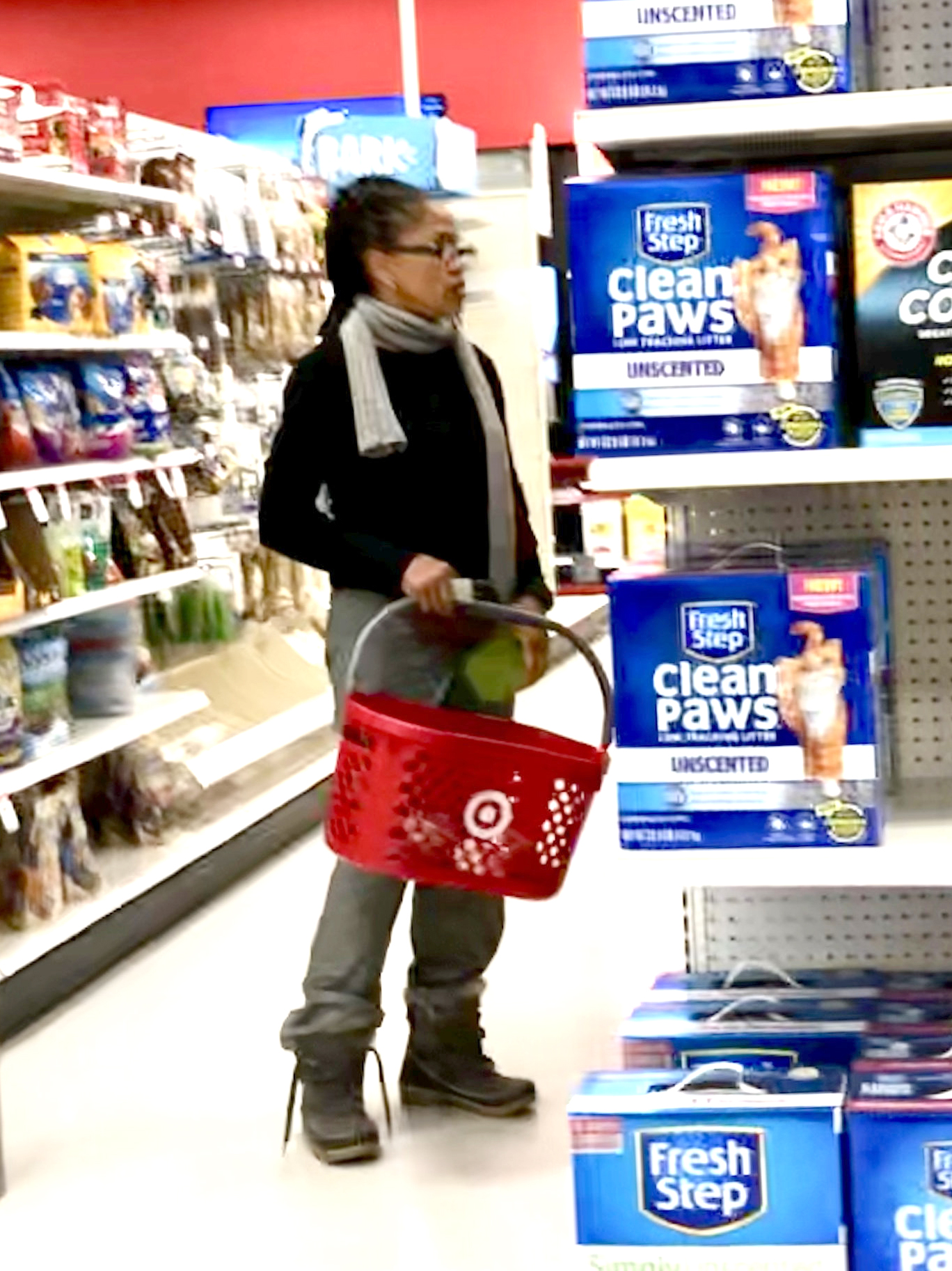 Meghan Markle's mom Doria Ragland shopping at target wearing jeans, a blue sweater, and white scarf