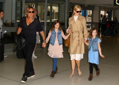 Keith Urban and Nicole Kidman walking with their kids