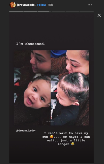 Jordyn Woods holding Stormi Webster