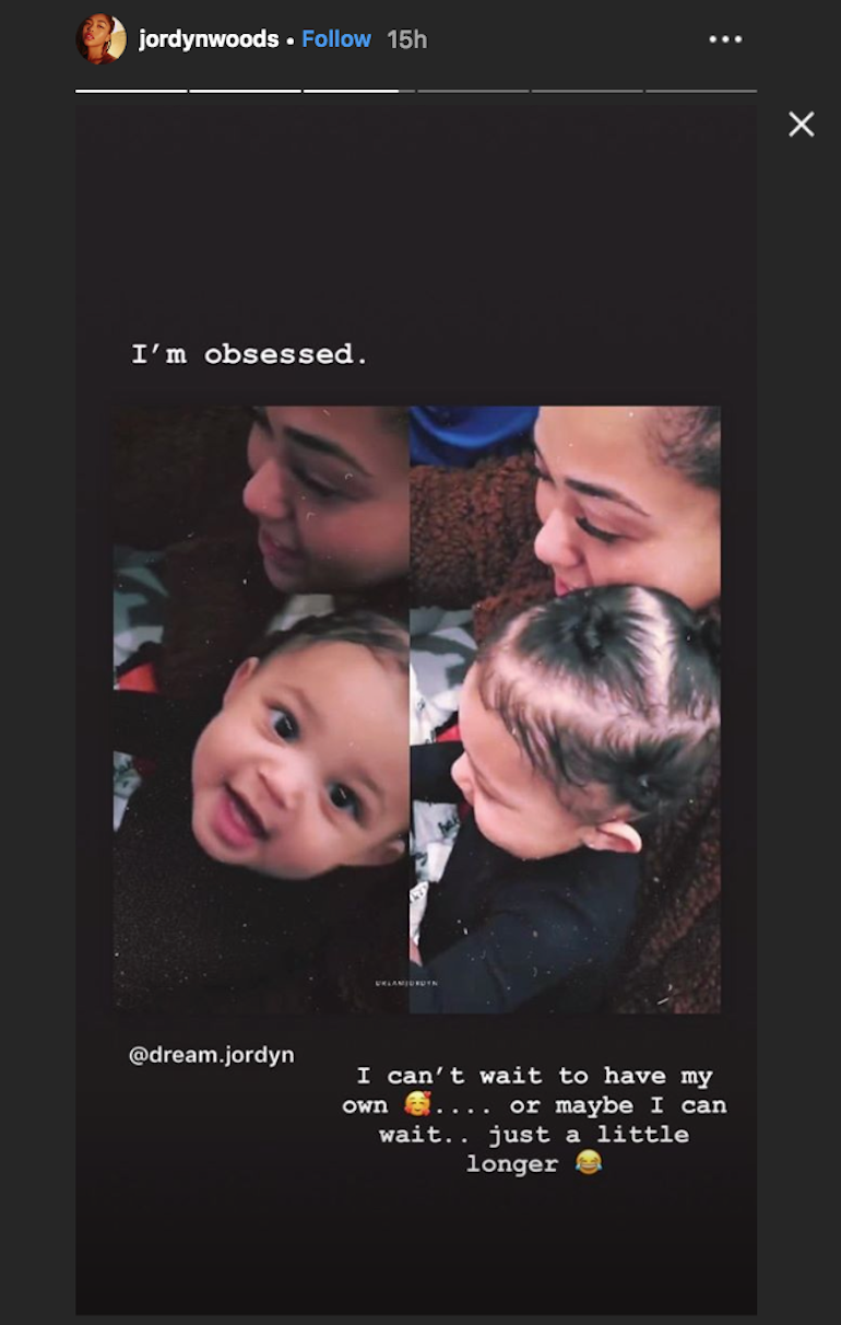 Jordyn Woods holding Stormi Webster