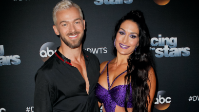 Nikki Bella posing with Artem Chigvintsev ahead of Dancing with the Stars