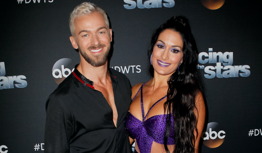 Nikki Bella posing with Artem Chigvintsev ahead of Dancing with the Stars