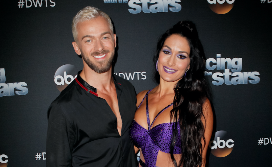 Nikki Bella posing with Artem Chigvintsev ahead of Dancing with the Stars