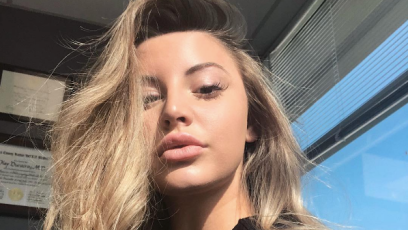 Model Ashley Alexiss posing for a selfie in the sunshine