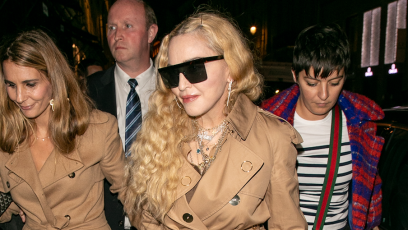 Madonna walking in Paris in a beige coat with black sunglasses