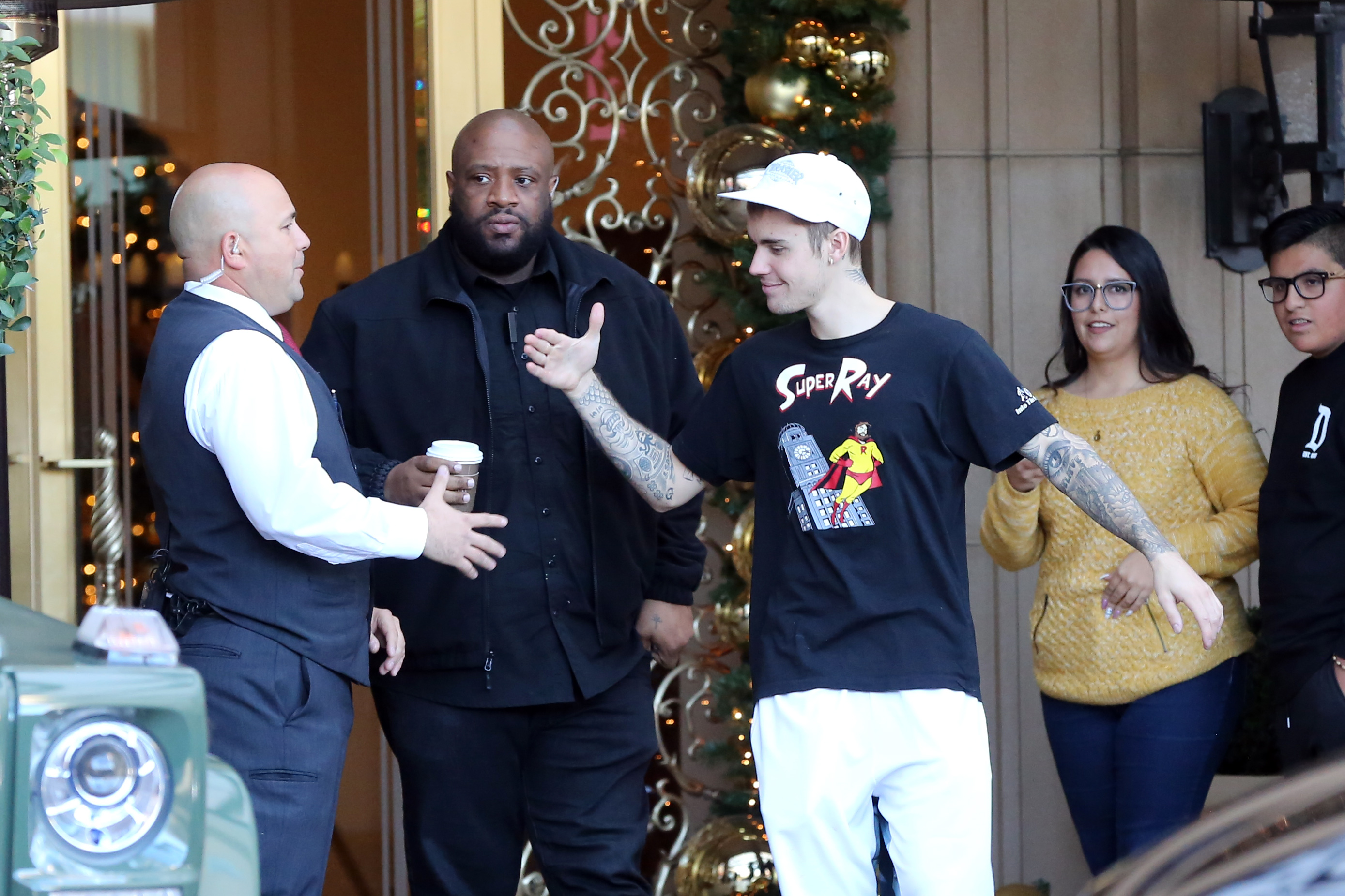 justin bieber all smiles at hotel with fans