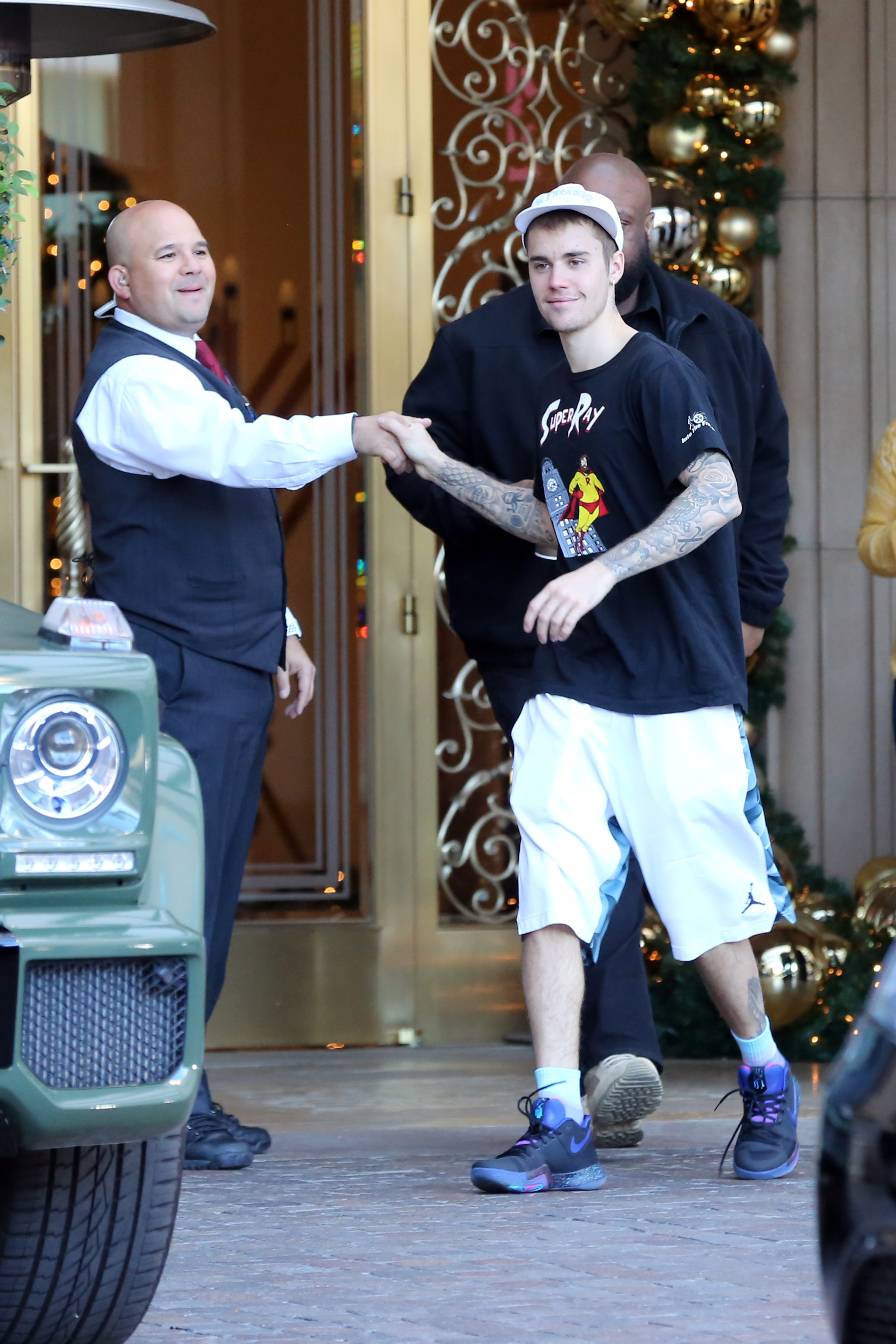 justin bieber all smiles at hotel with fans