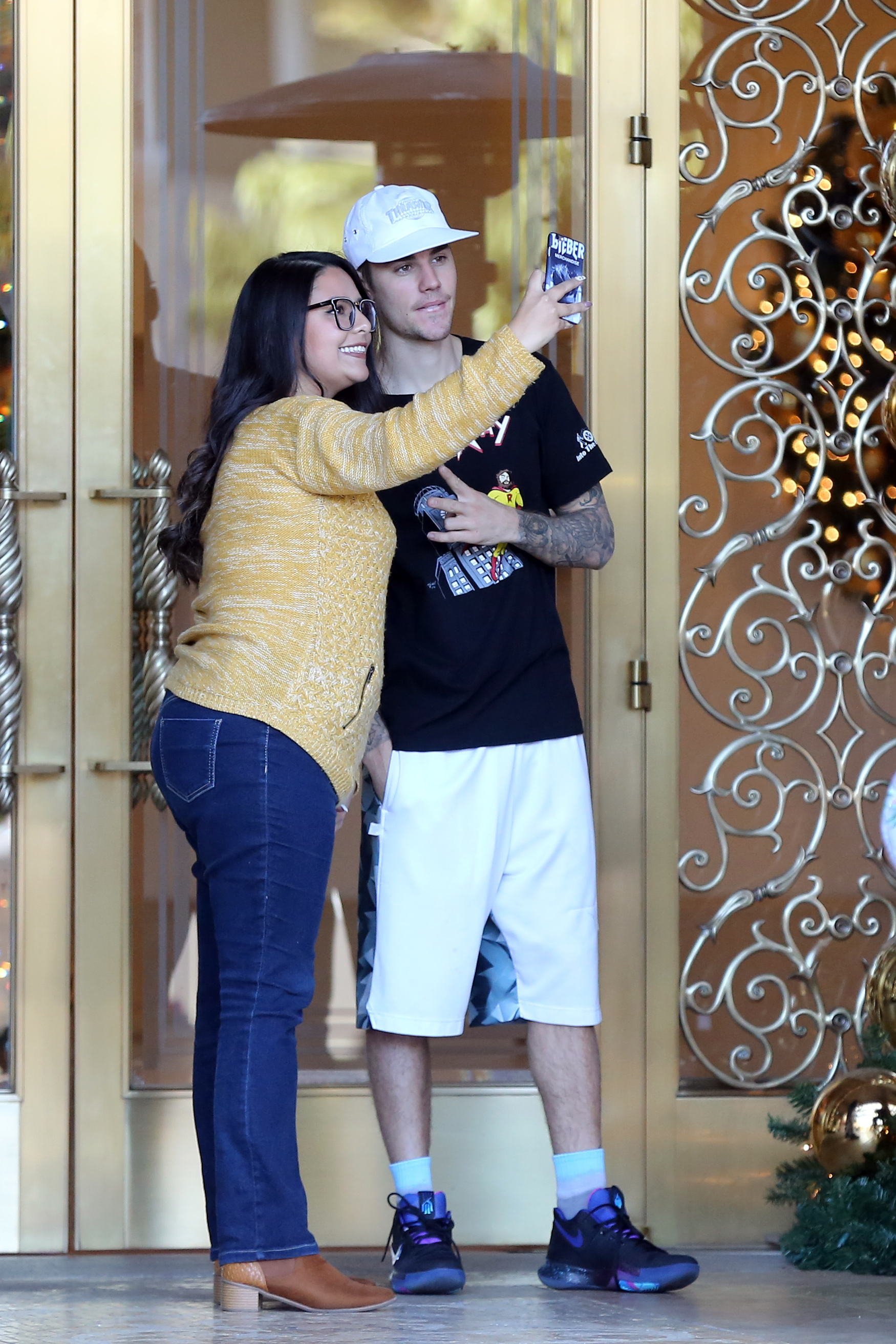 justin bieber all smiles at hotel with fans