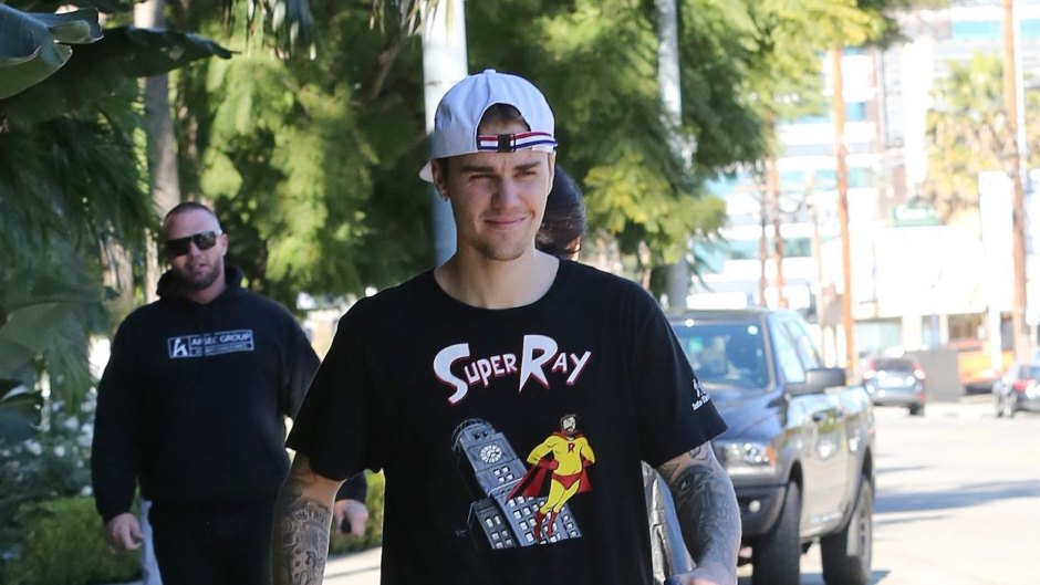 justin bieber all smiles at hotel with fans