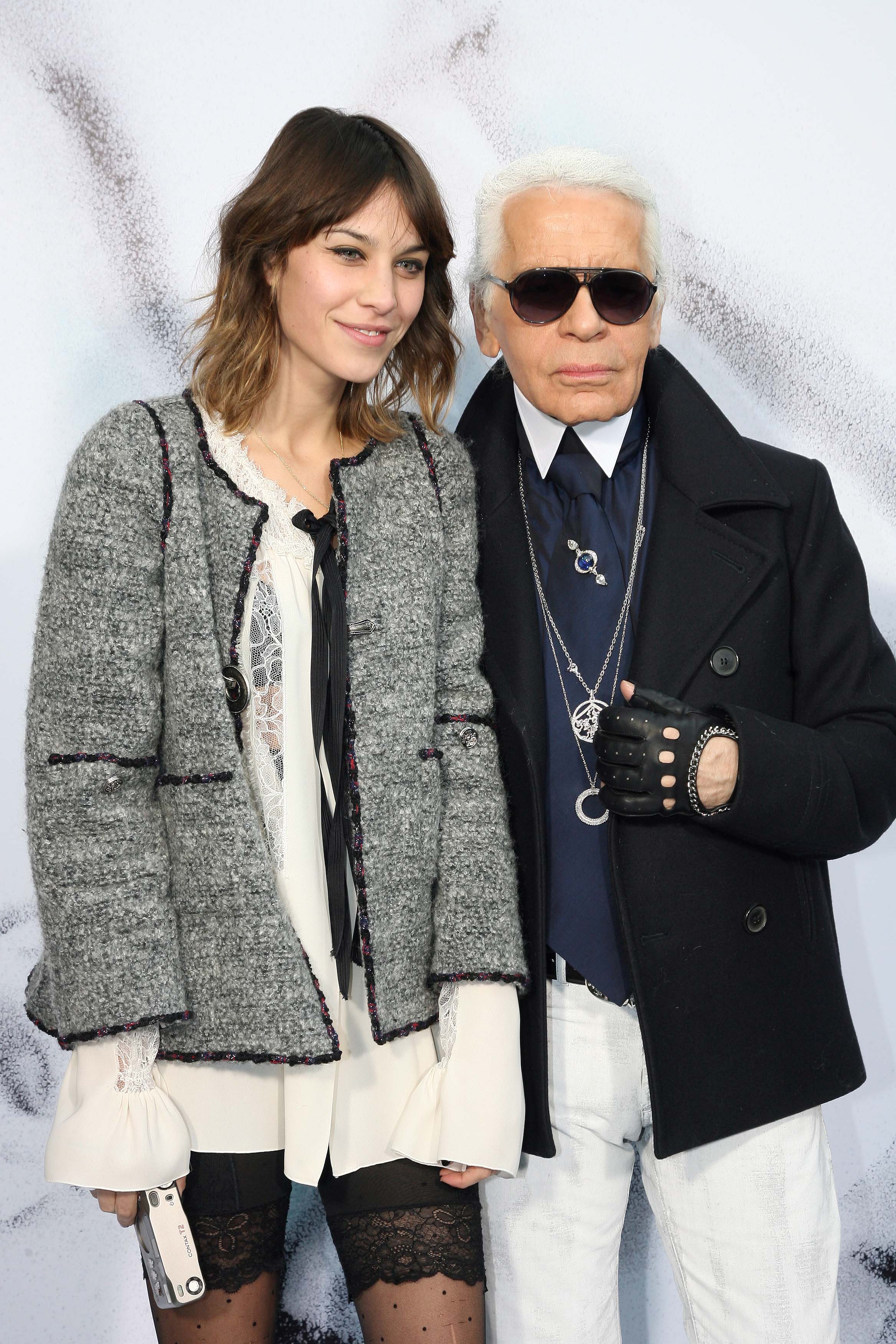 Karl Lagerfeld posing with Alexa Chung