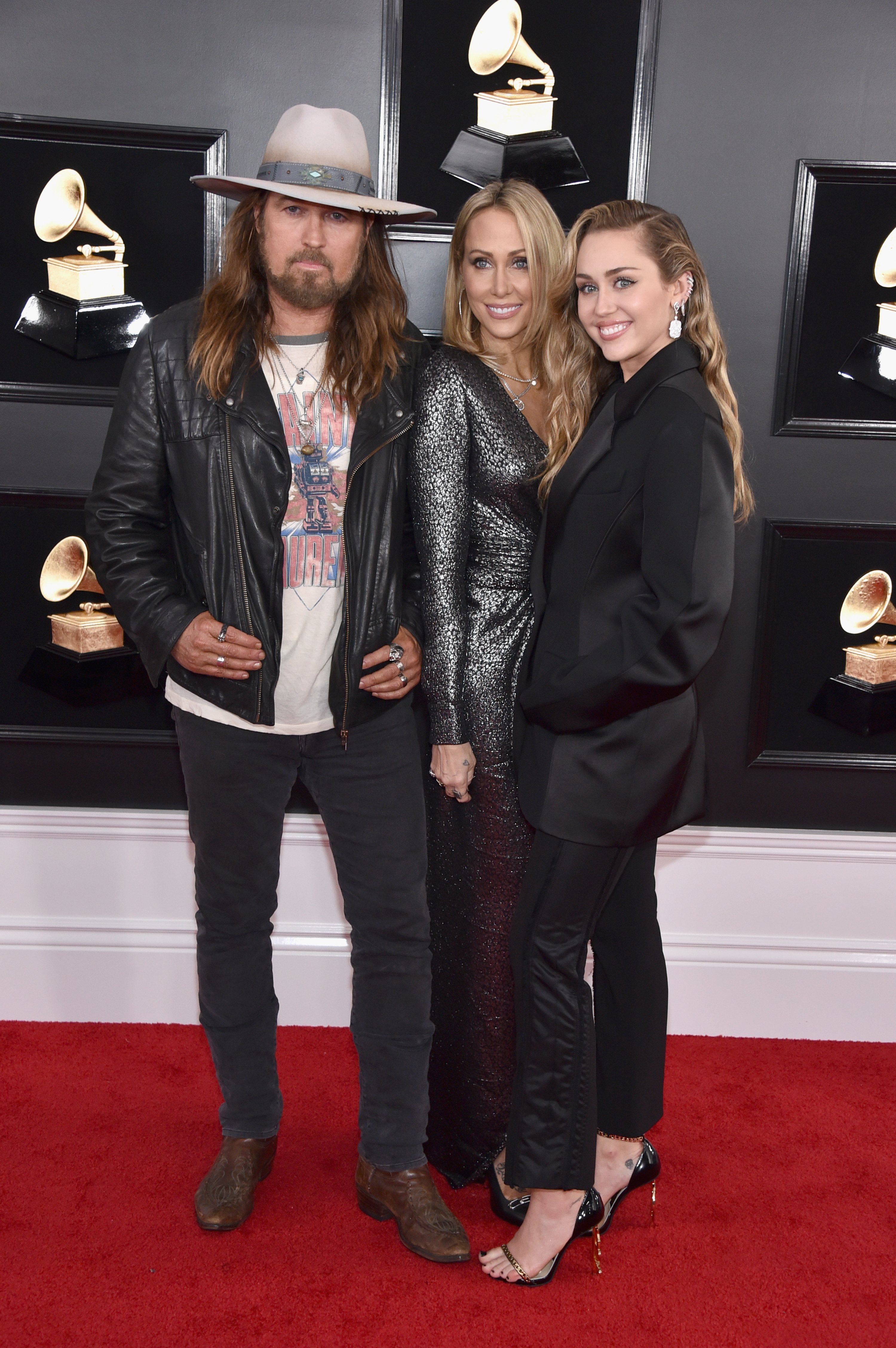 Miley Cyrus wears black suit at Grammys and with her parents