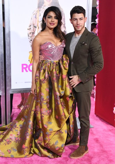 Nick Jonas Priyanka Chopra isn't it romantic premiere flowerd vivienne westwood gown