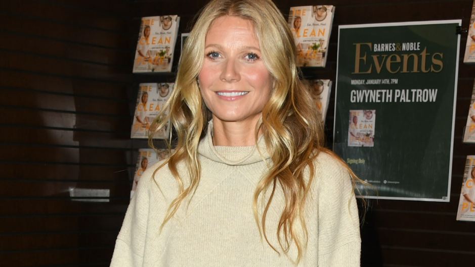 Gwyneth Paltrow smiling wearing a beige sweater