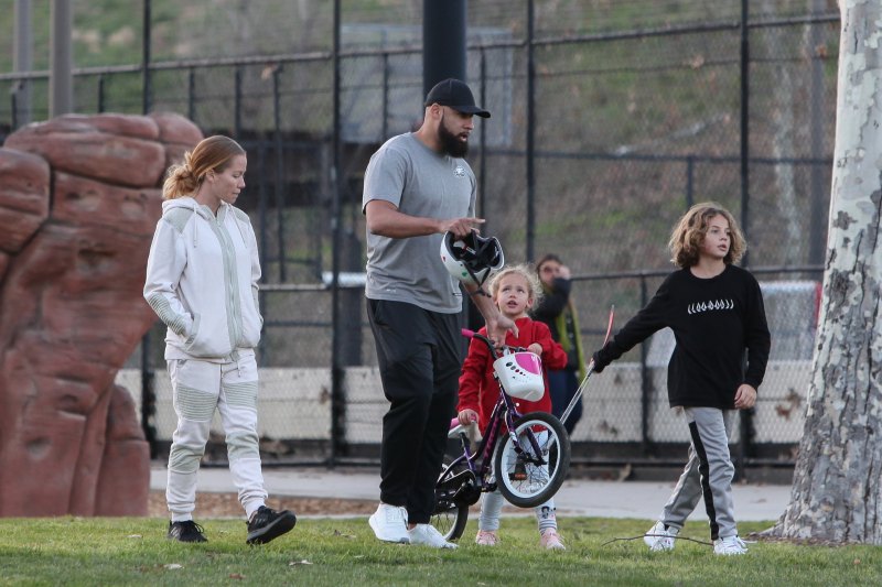 Kendra Wilkinson and Hank Baskett reunite for co-parenting their kids at the park and watch Alijah learn how to ride a bicycle.