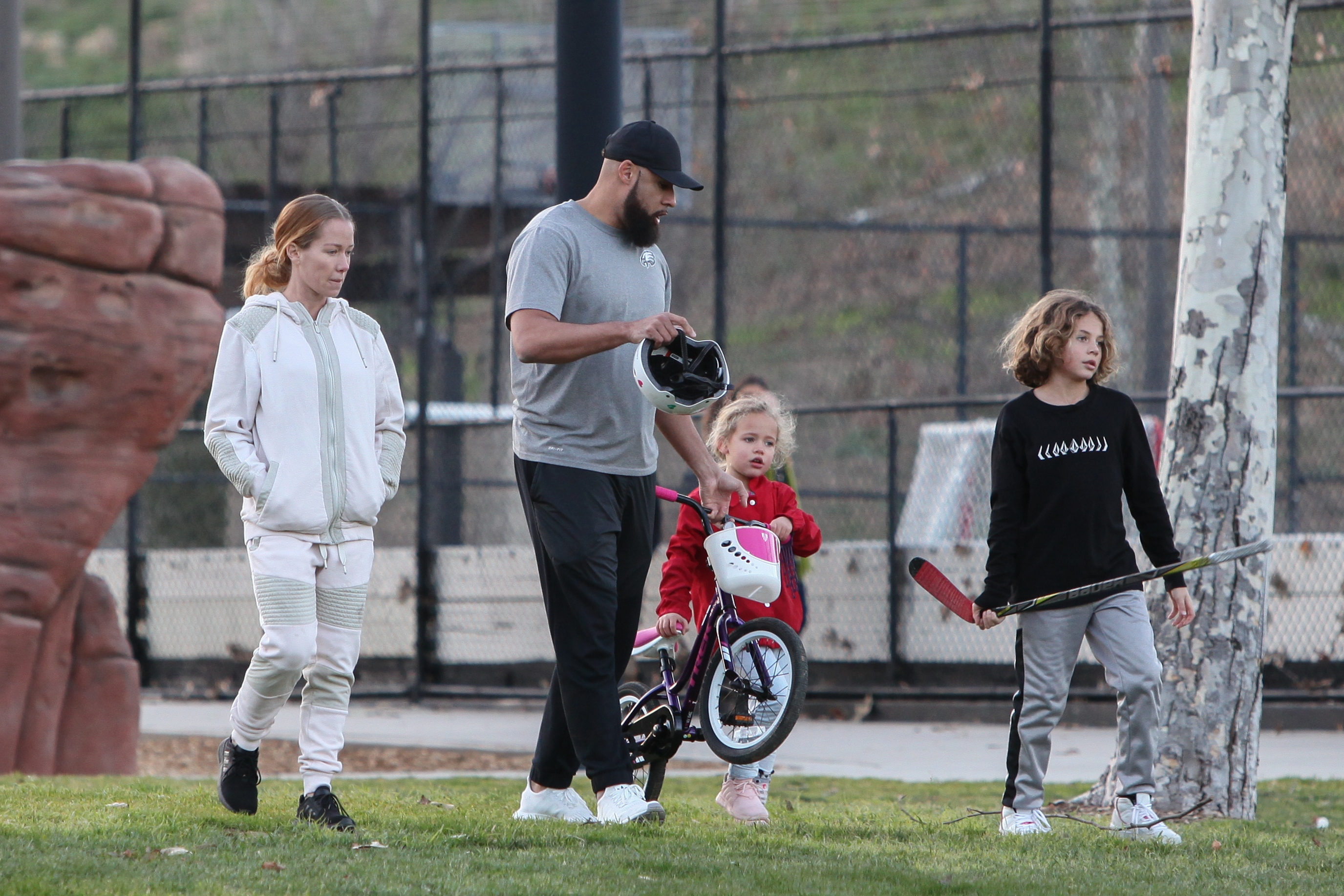 Kendra Wilkinson and Hank Baskett reunite for co-parenting their kids at the park and watch Alijah learn how to ride a bicycle.