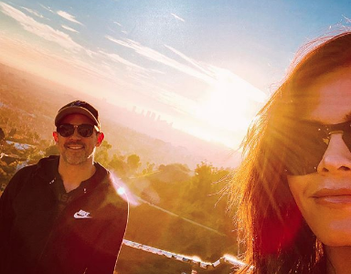 Jenna Dewan and Steve Kazee posing for a selfie in front of a sunset