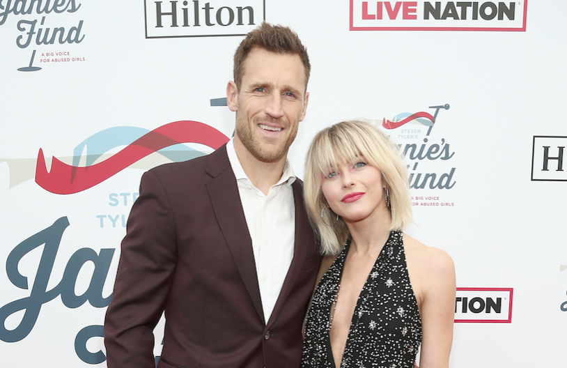 Julianne Hough posing with her husband Brooks Laich