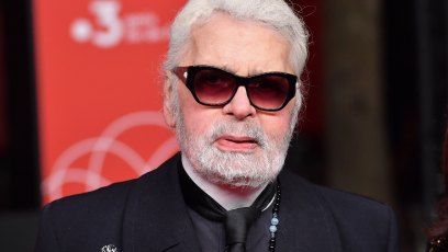 Karl Lagerfeld wearing black sunglasses and a black blazer