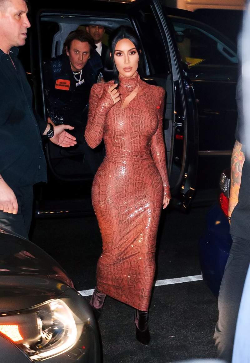 Kim Kardashian walking in NYC wearing a skintight, snakeskin dress