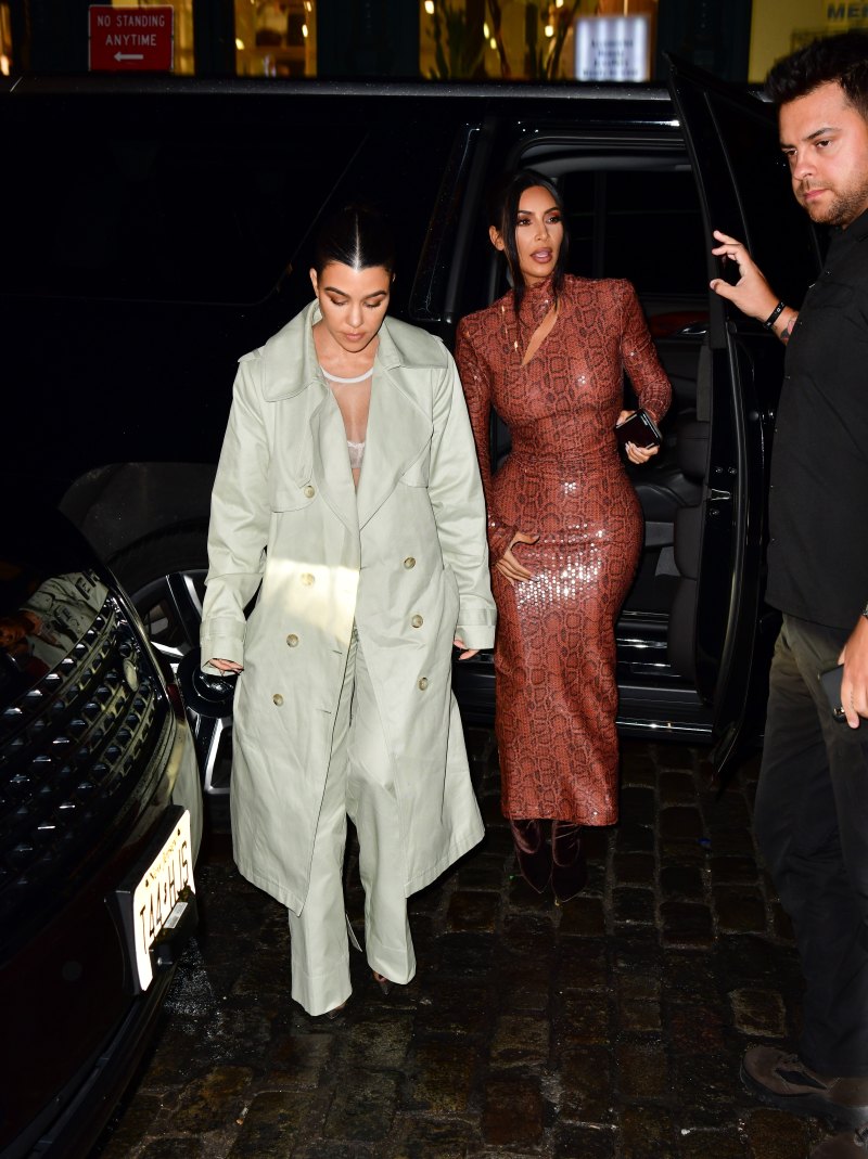 Kim Kardashian walking in NYC wearing a skintight, snakeskin dress