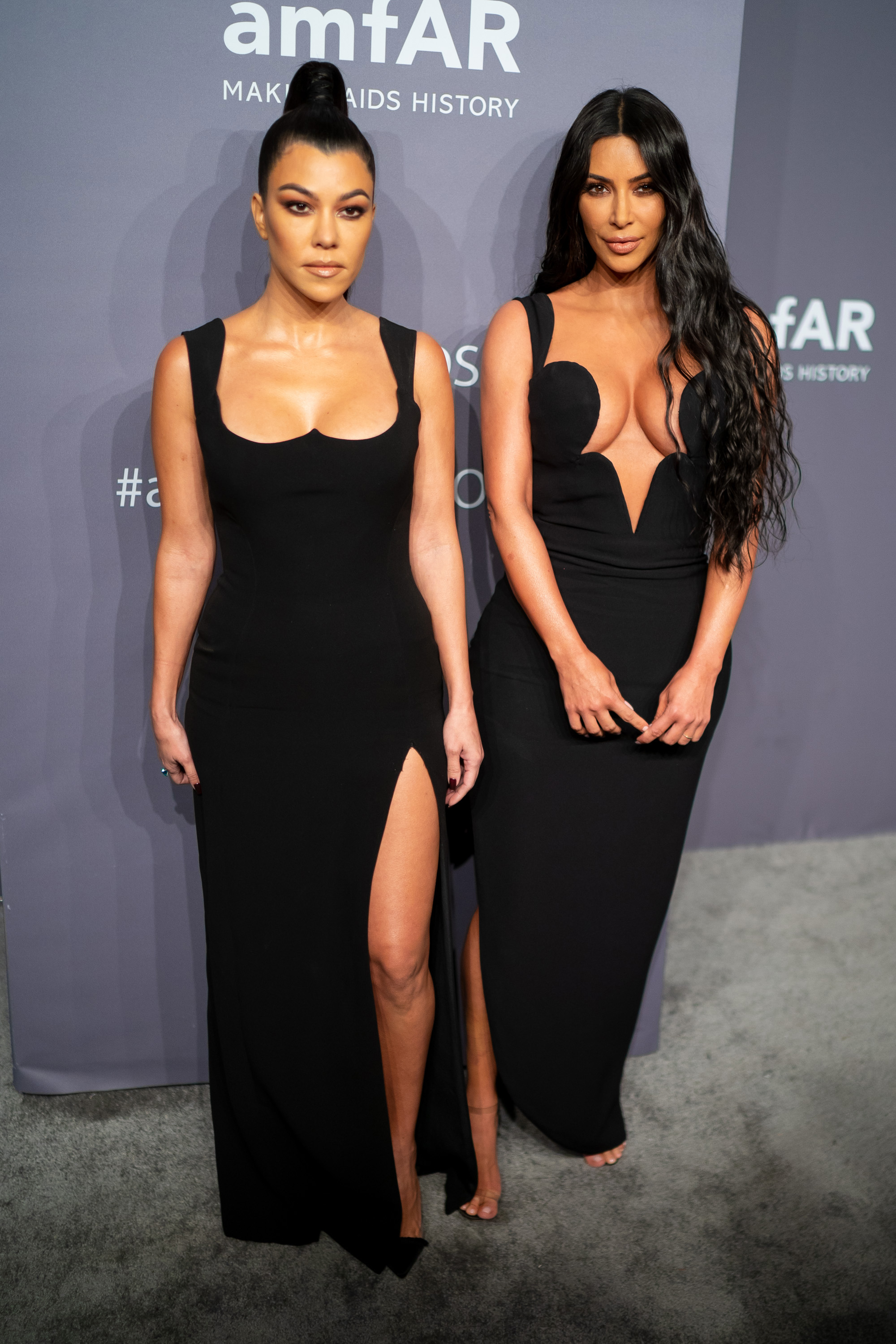 Kim Kardashian West and Kourtney Kardashian arrive to the amfAR Gala New York 2019 at Cipriani Wall Street on February 6, 2019 in New York City.