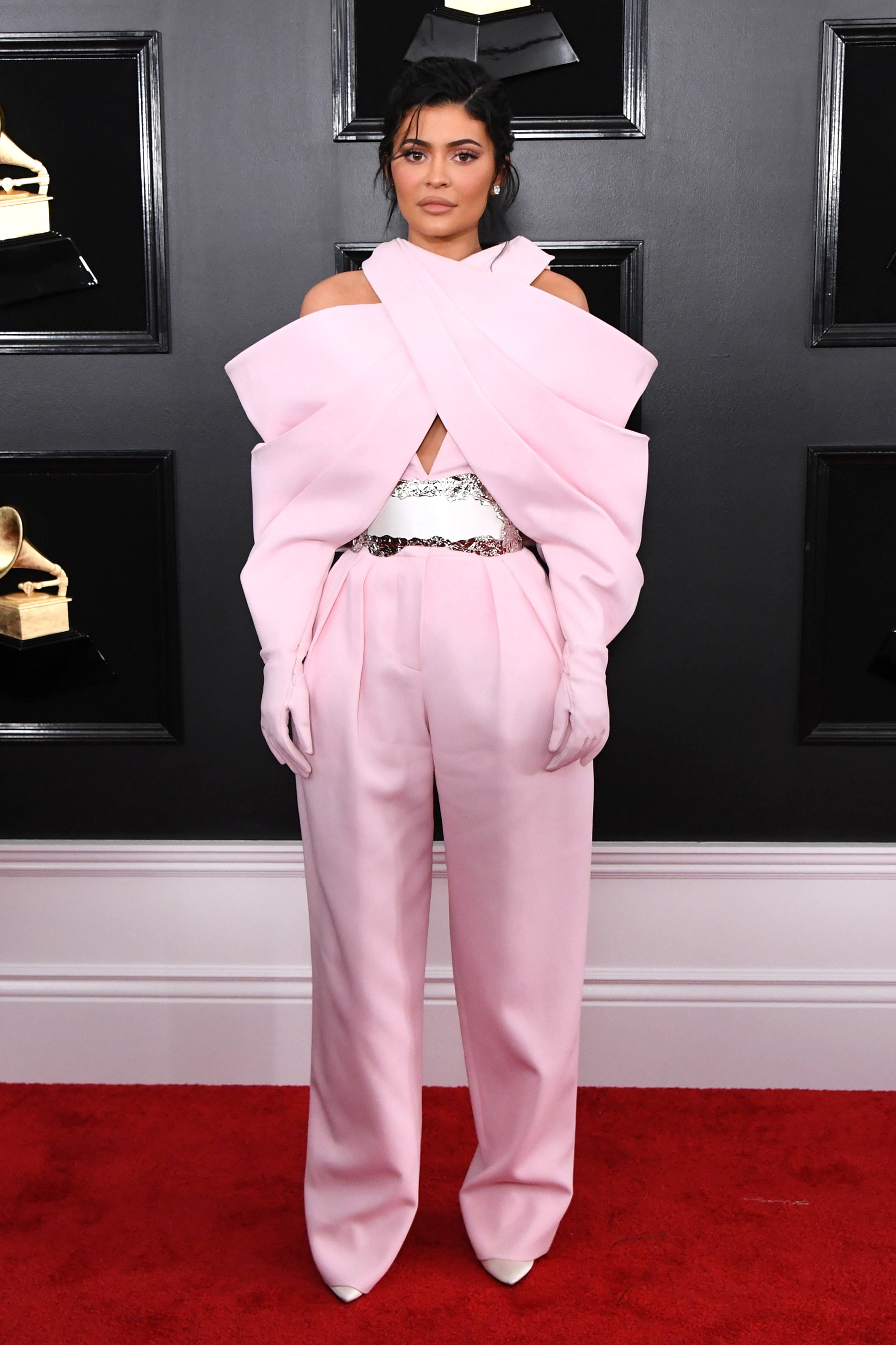Kylie Jenner at the 2019 Grammy Awards wearing a pink jumpsuit