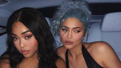 Jordyn Woods and Kylie Jenner posing in car