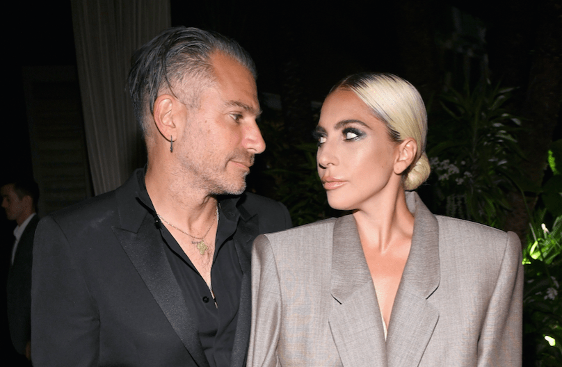 Lady Gaga and ex-fiance Christian Carino posing and looking at each other
