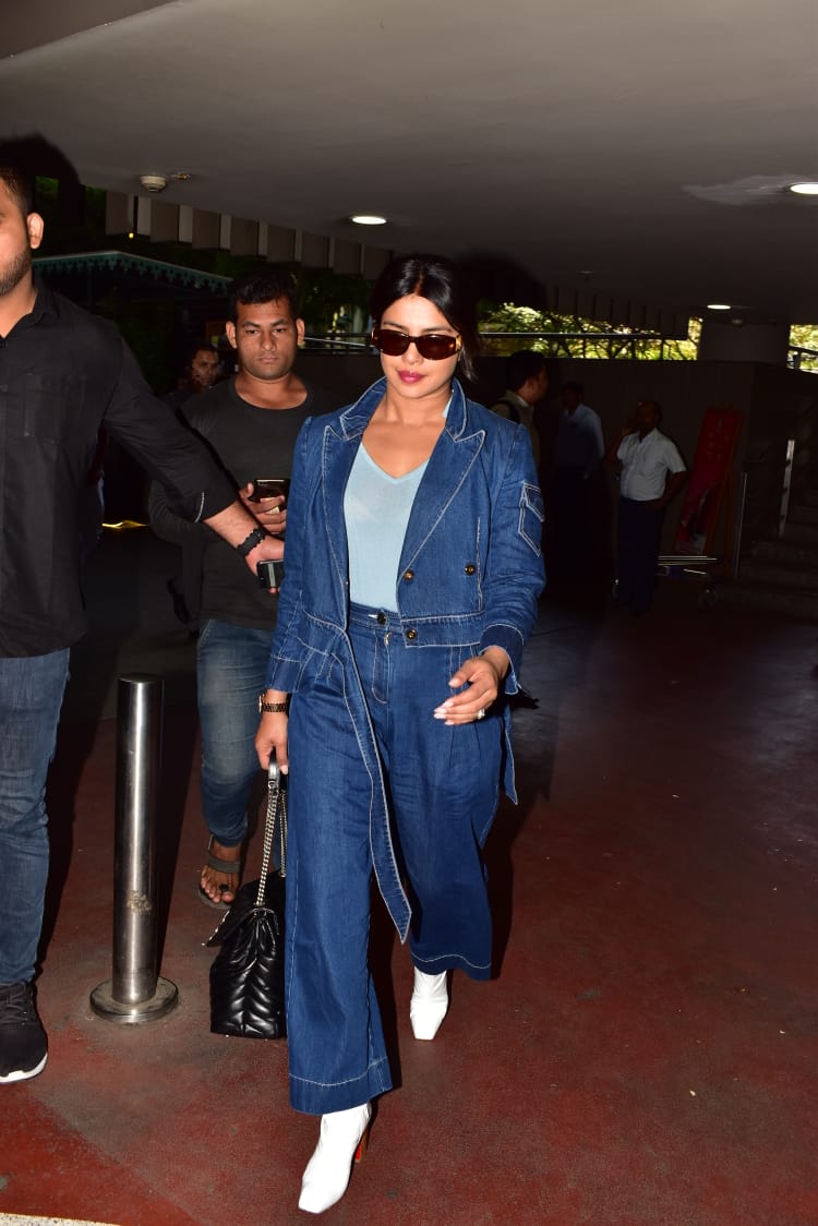 Priyanka Chopra wearing a 2 piece denim suit in the Mumbai airport