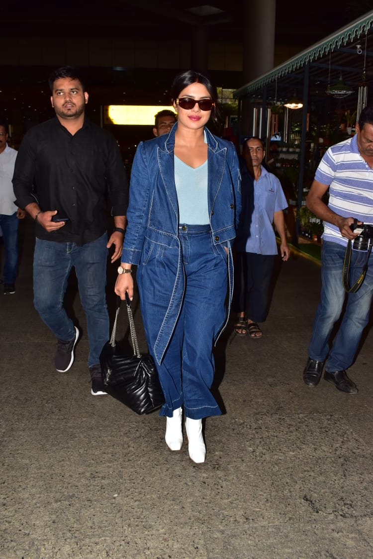Priyanka Chopra wearing a 2 piece denim suit in the Mumbai airport