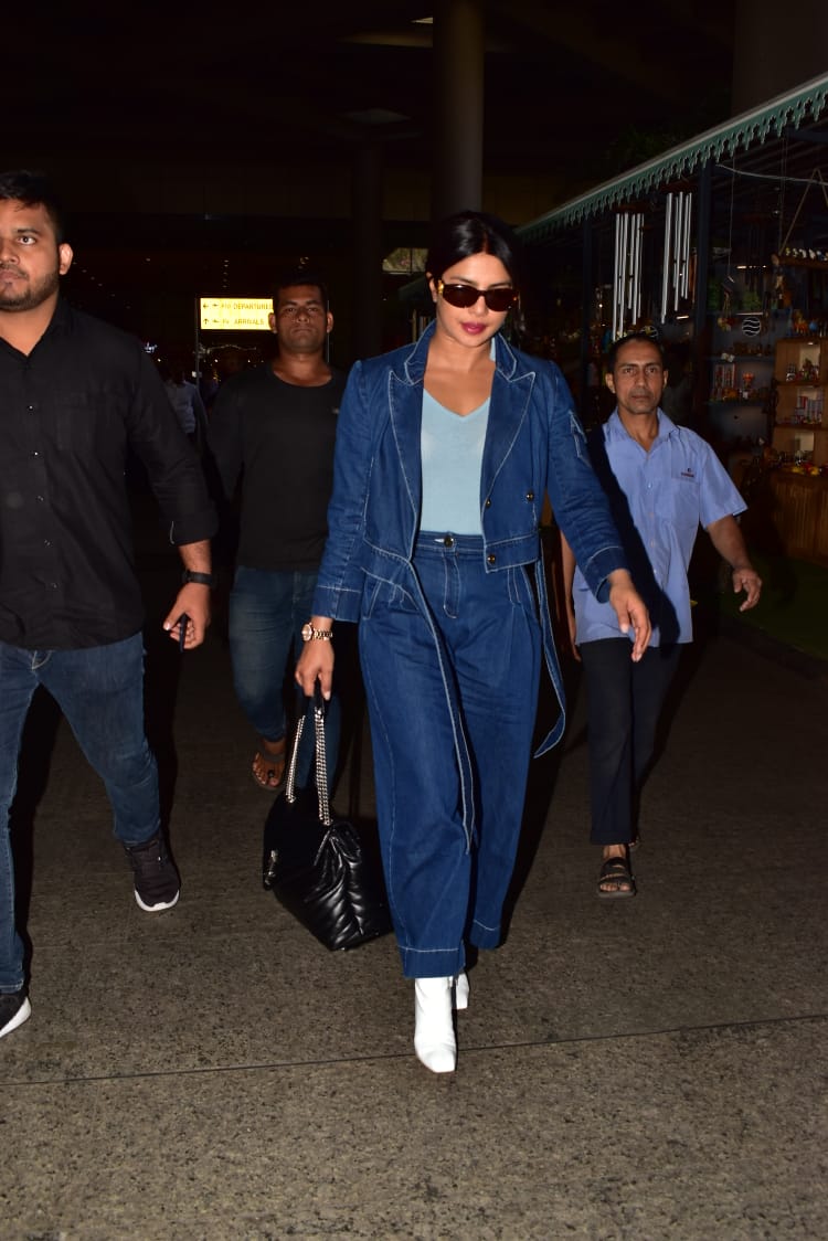 Priyanka Chopra wearing a 2 piece denim suit in the Mumbai airport