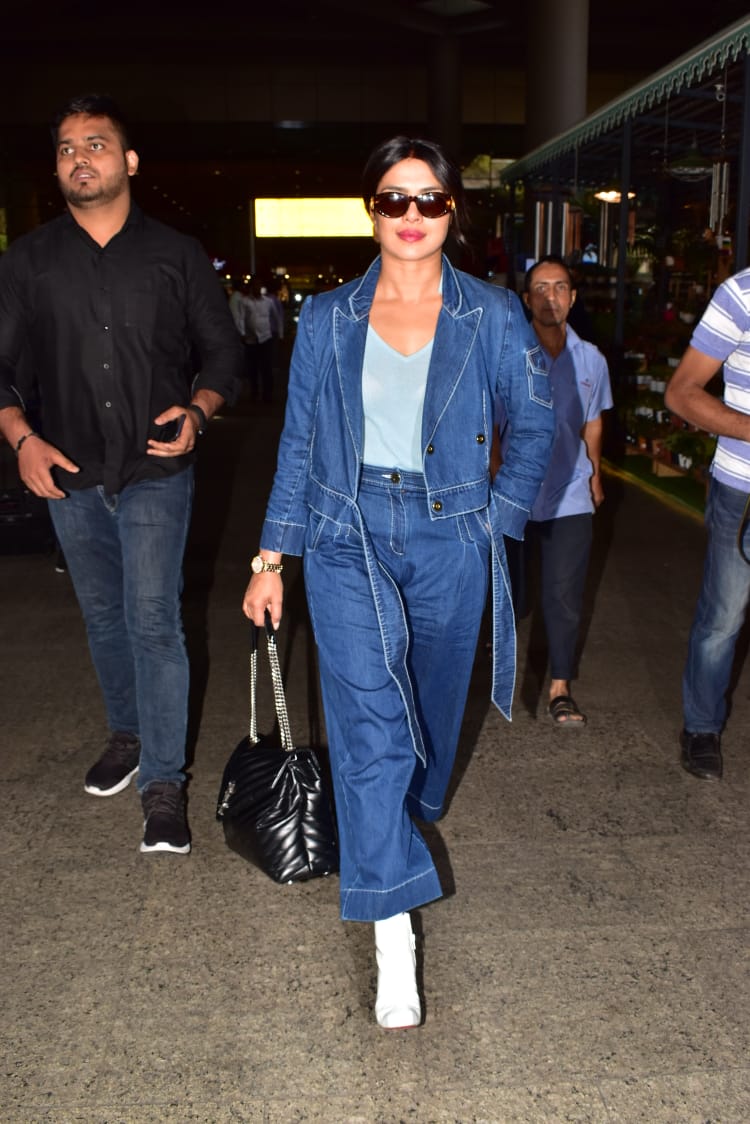 Priyanka Chopra wearing a 2 piece denim suit in the Mumbai airport