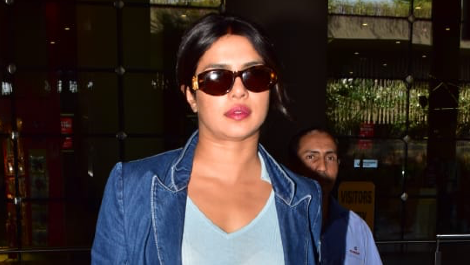 Priyanka Chopra wearing a 2 piece denim suit in the Mumbai airport