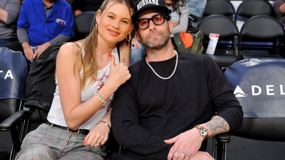 Model Behati Prinsloo and Adam Levine attend a basketball game between the Los Angeles Lakers and the Phoenix Suns at Staples Center on December 02, 2018 in Los Angeles, California.