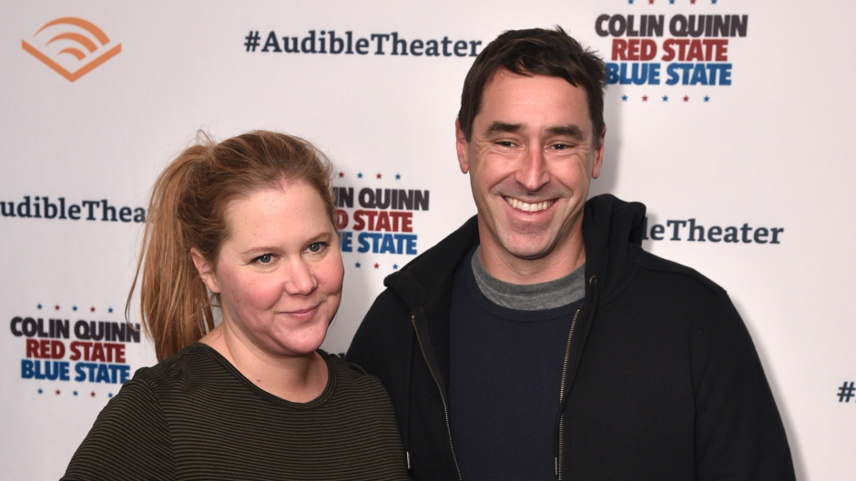Amy Schumer posing with husband Chris Fischer.