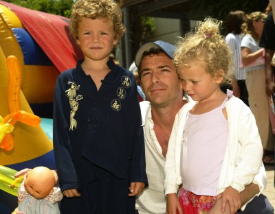 Luke Perry with his two kids at an event