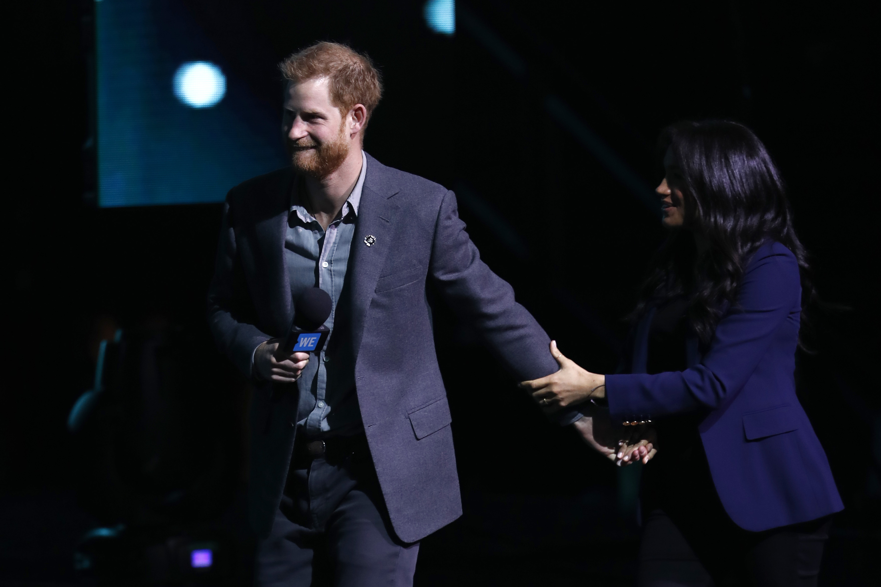 Prince Harry Meghan Markle holding hands