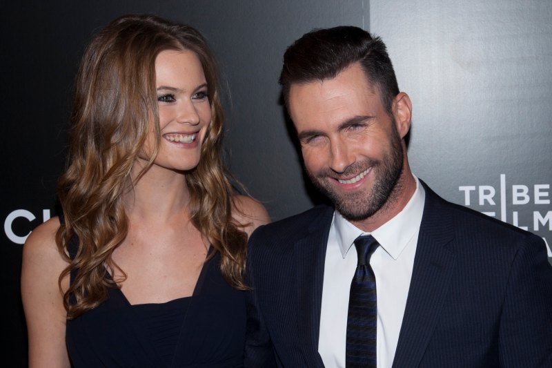 behati and adam levine at an event