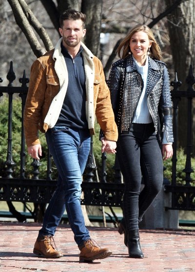 Bachelorette Hannah Brown holding hands with her first date in Boston while filming the hit reality show