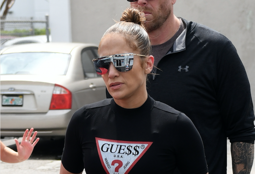 Jennifer Lopez wears her massive engagement ring while hitting the gym in Miami.