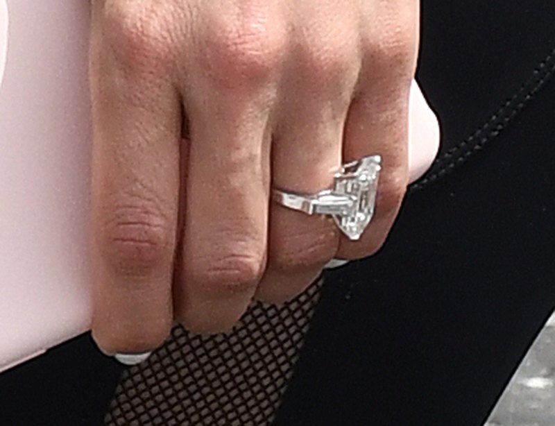 Newly engaged Jennifer Lopez shows off her massive engagement ring as she arrives to the gym in Miami