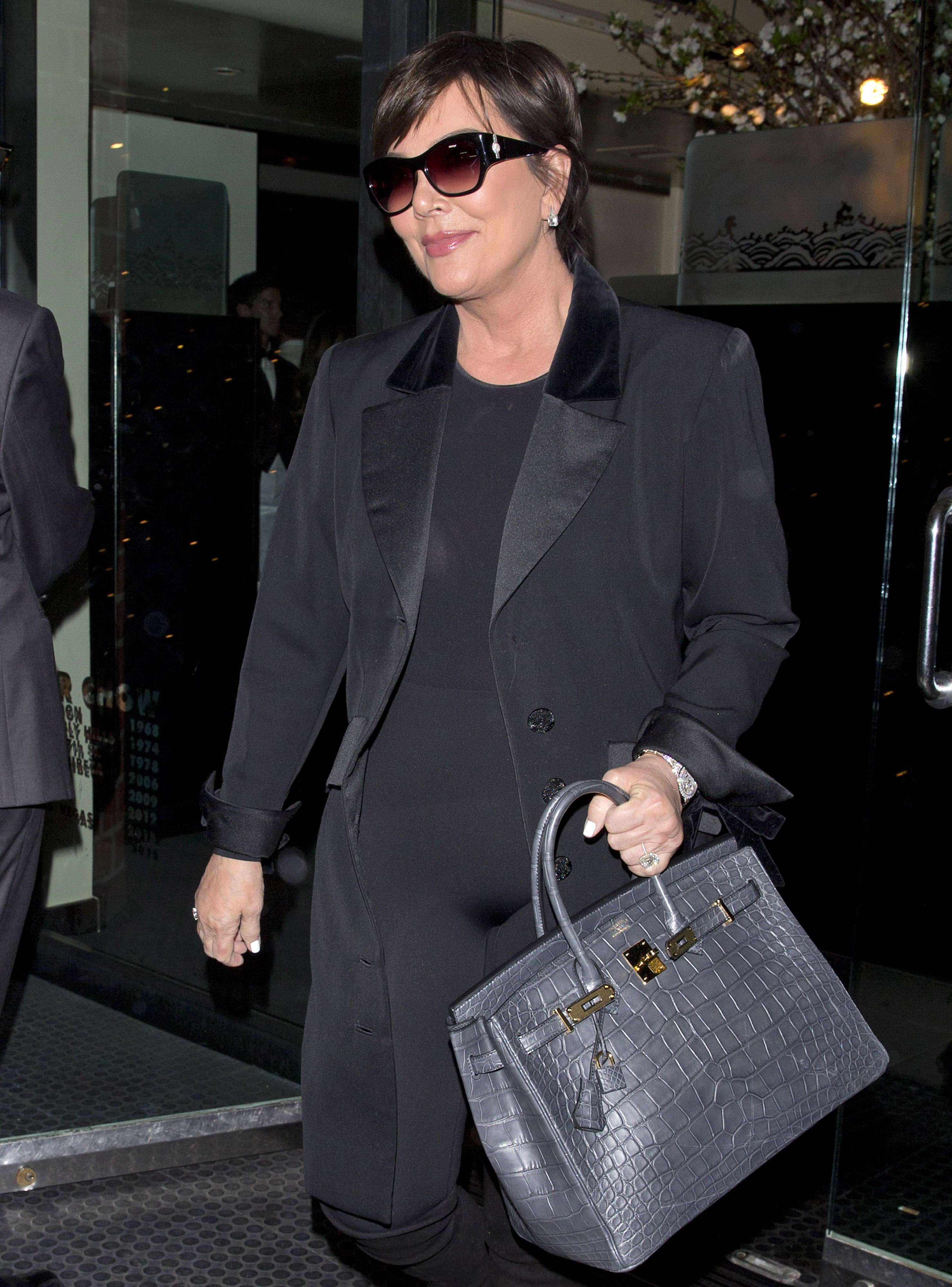 Kris Jenner walking in Beverley Hills wearing an all black outfit.