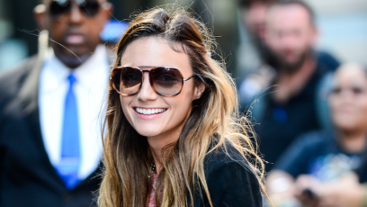 Laura Perlongo smiling with sunglasses on.