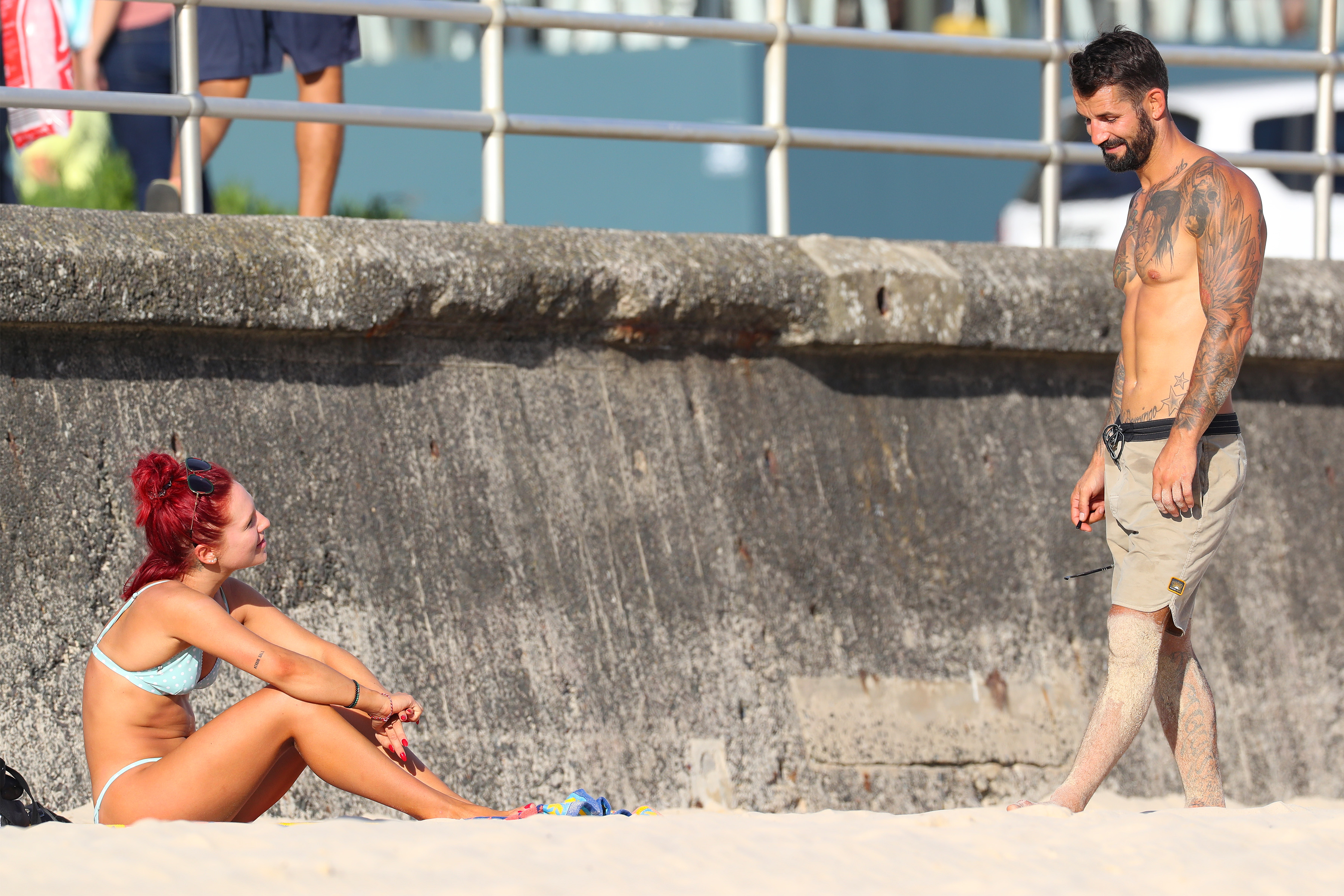 EXCLUSIVE: DWTS judge Sharna Burgess pictured at the Bondi Beach chatting to a mystery man.